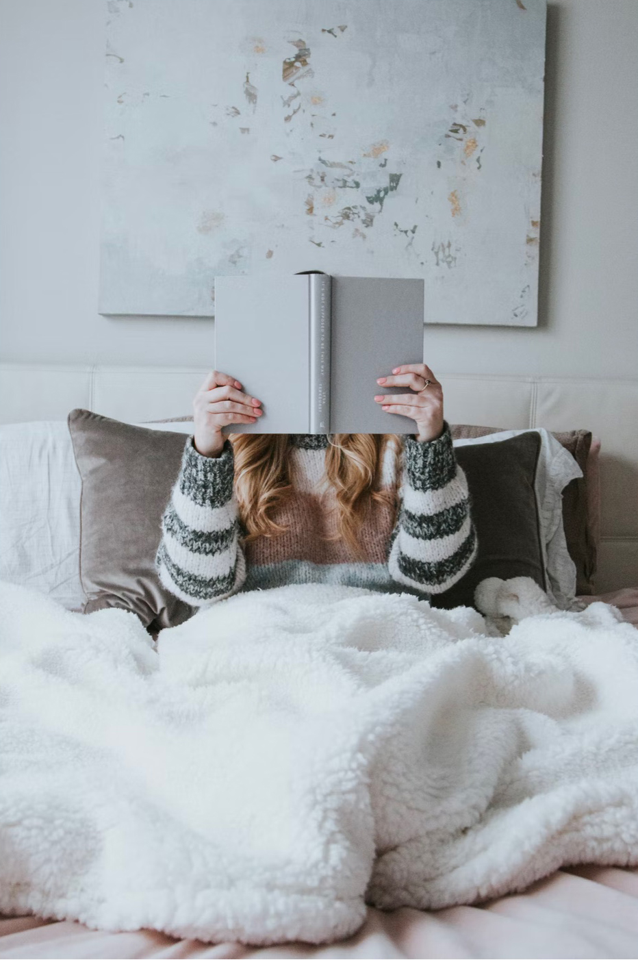 image of a woman reading a book